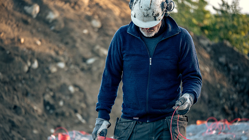 Workman in Woolpower work clothes