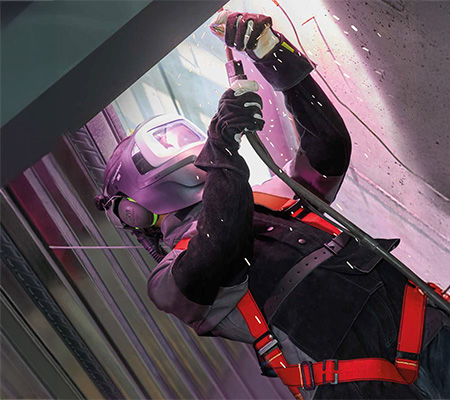 Welder at height wears flame-retardant drop harness from 3M